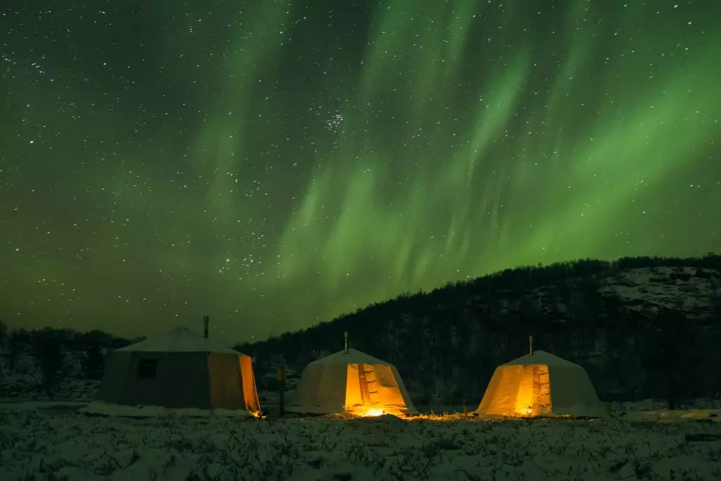 Tents under the Northern Lights in Norway.